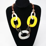 MP Large Hoops Necklace featuring large yellow and white lacaquered hoops - Close up